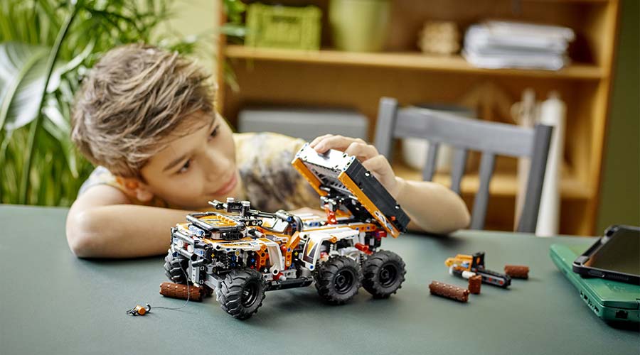 Child playing with vehicle