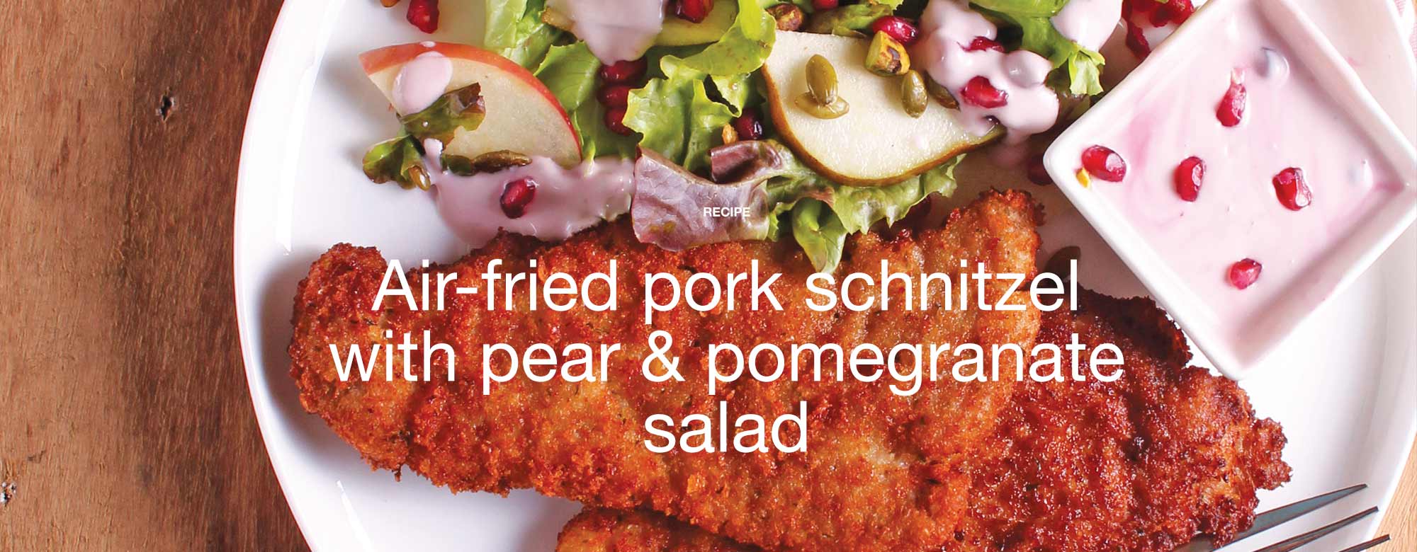 Air-fried pork schnitzel with pear & pomegranate salad