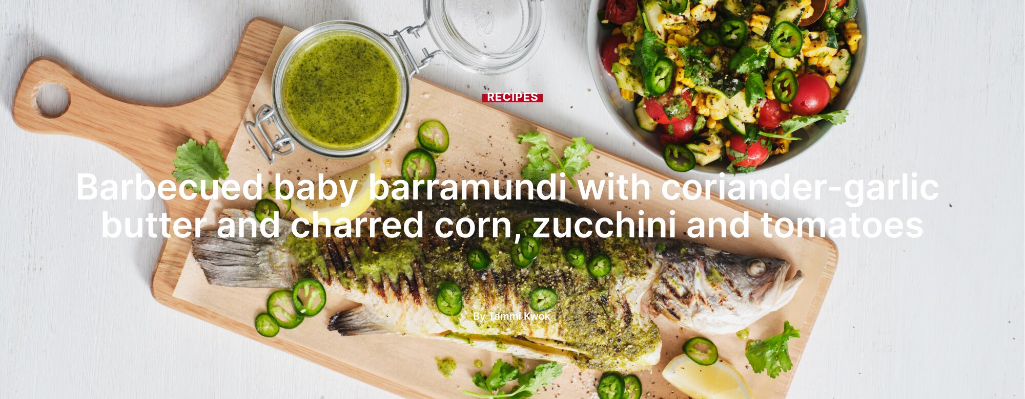 Barbecued baby barramundi with coriander-garlic butter and charred corn, zucchini and tomatoes