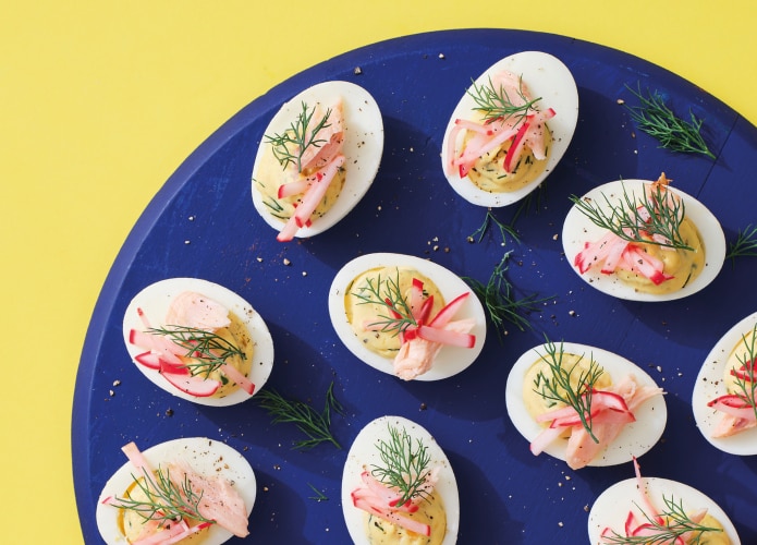 Devilled eggs with smoked trout and radish pickle