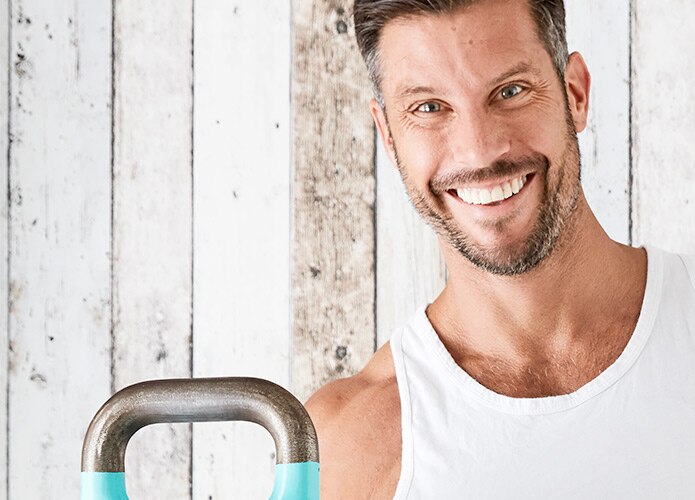 Sam Wood holding kettle bell