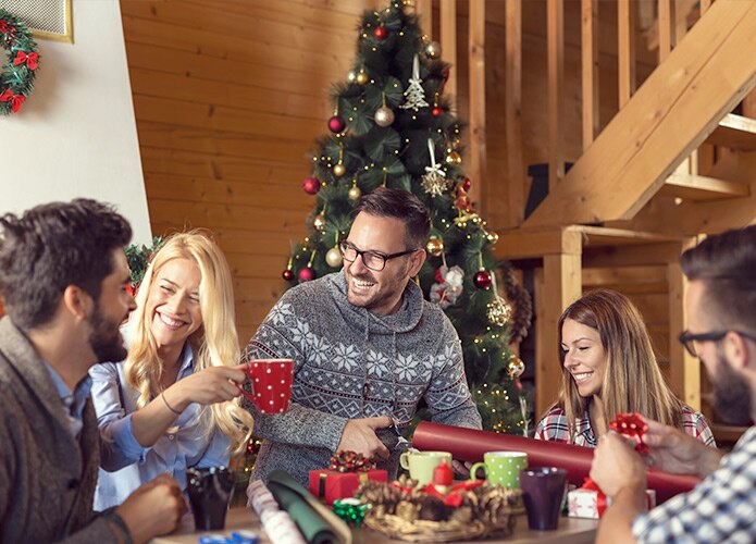 Friends wrapping Christmas presents