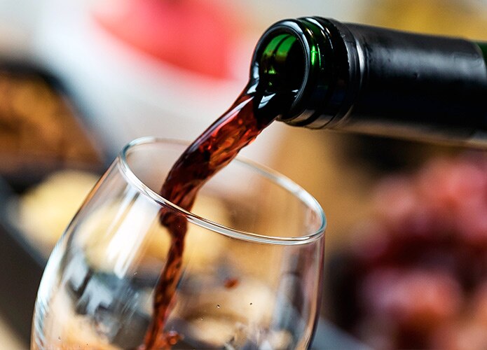 Red wine being poured into a glass