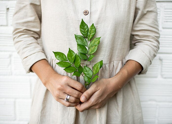 Woman holding leaf