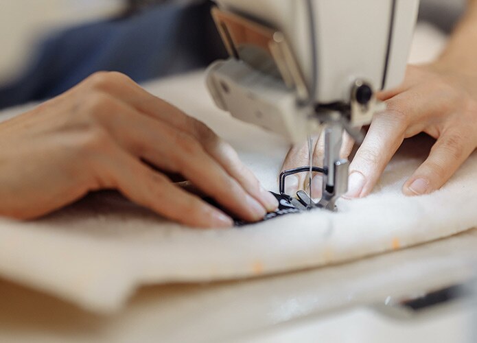 Hands at sewing machine