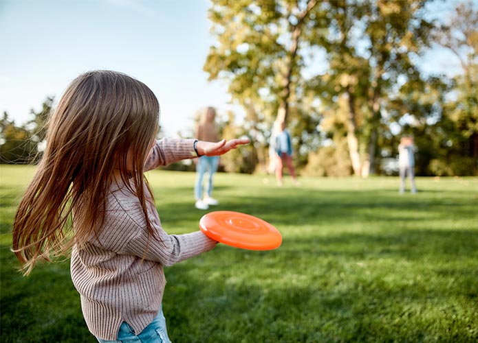 Girl throwing frisbee