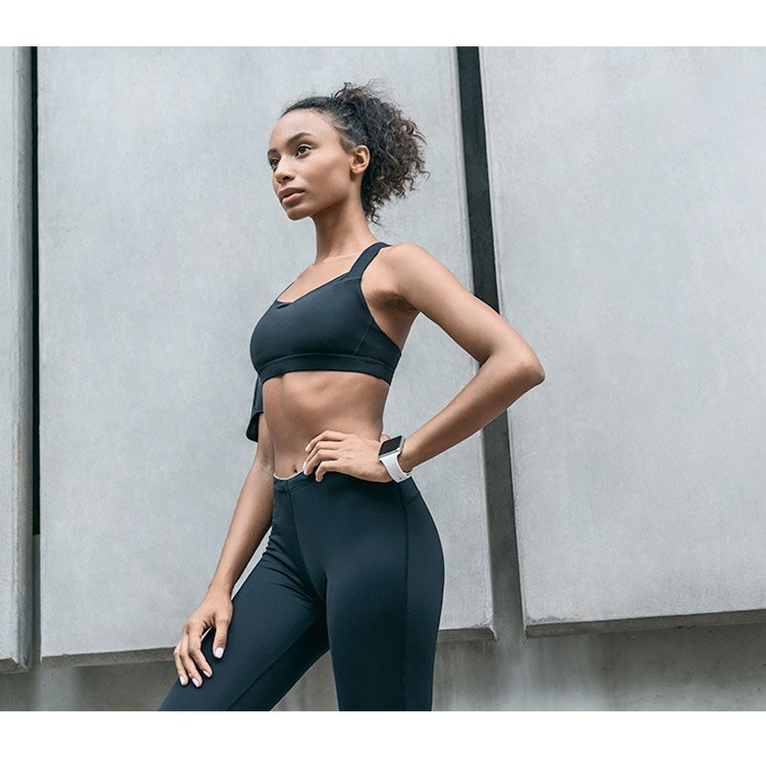 Woman posing in black activewear