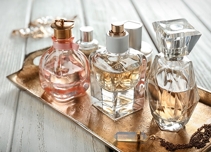 Perfume bottles on a gold tray