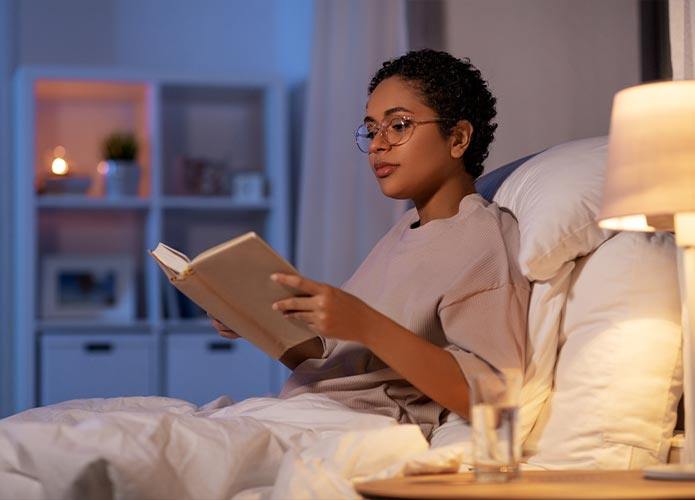 Woman reading in bed