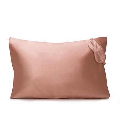 Pink satin pillow and eye mask