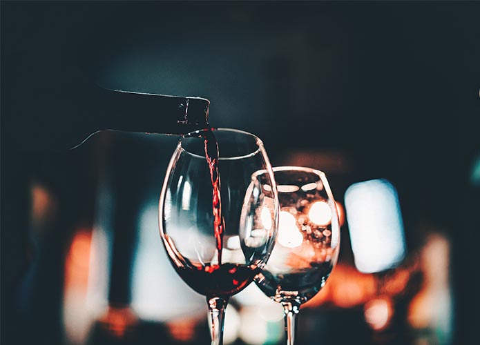 Red wine being poured into a glass