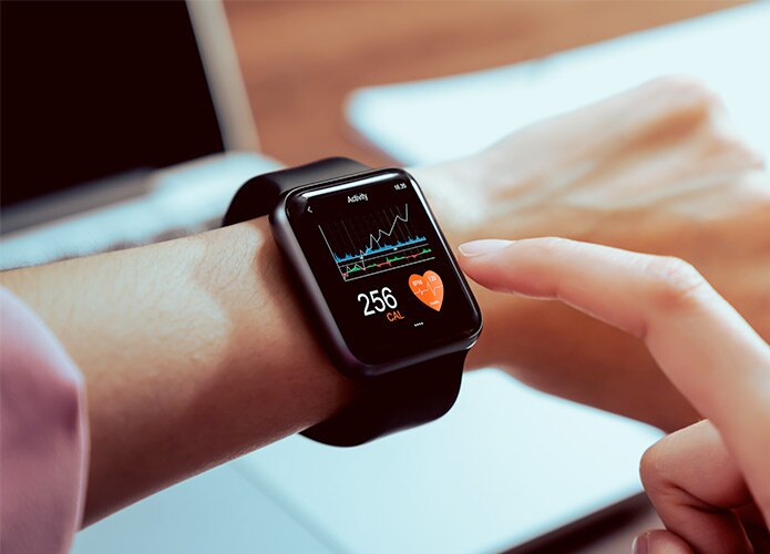 Person checking smart watch activity