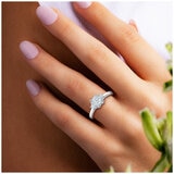 18KT White Gold 1.25ctw Three Stone Diamond Ring With 1ctw Centre